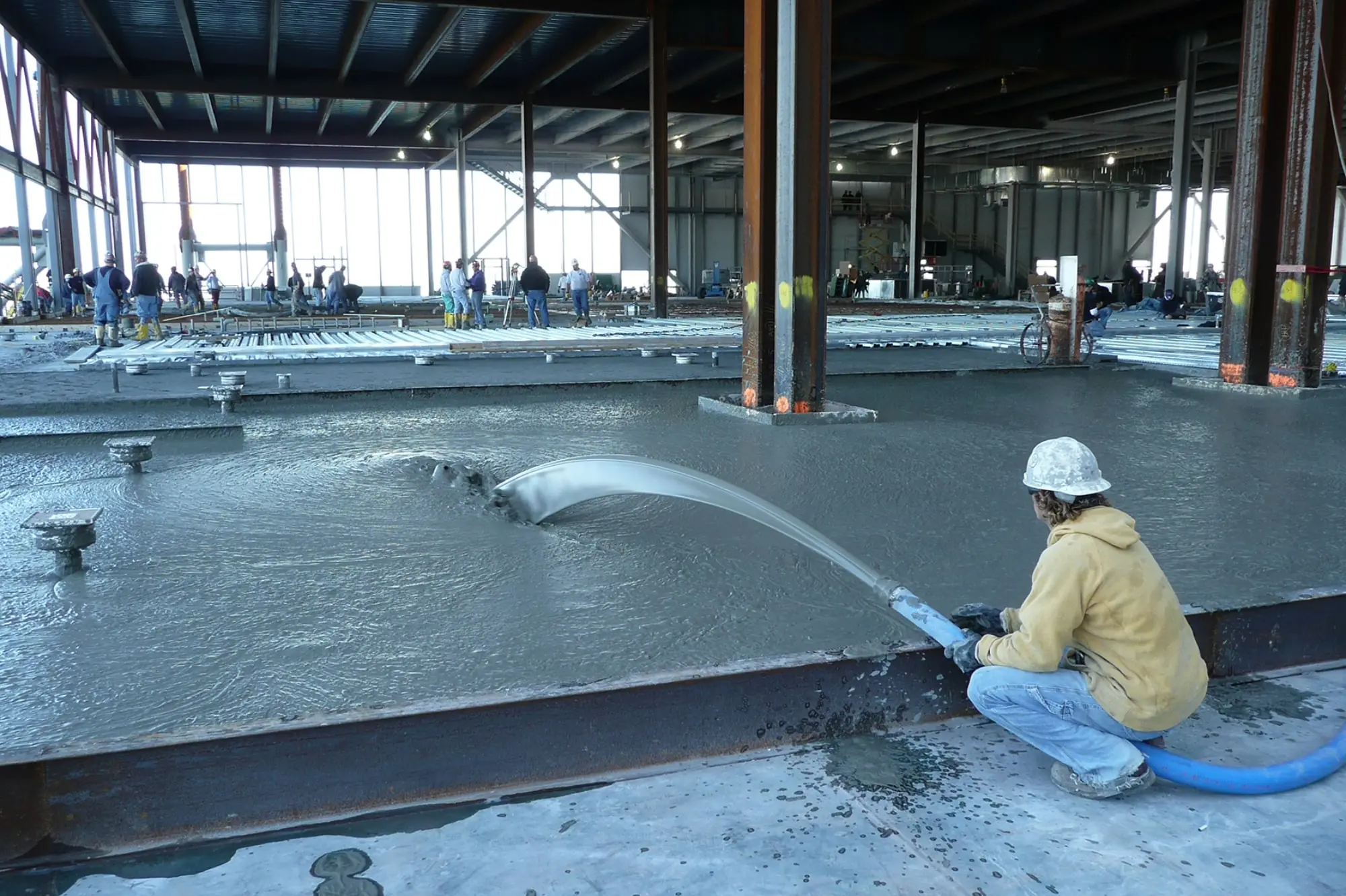 Elastizell Systems applying lightweight cellular concrete to pour a subfloor in Chicago, Illinois, for improved stability and insulation